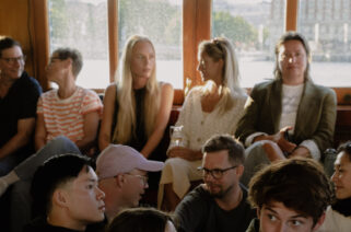 Audience on board the steamship Blidösund enjoying live music on the aft deck during the summer.