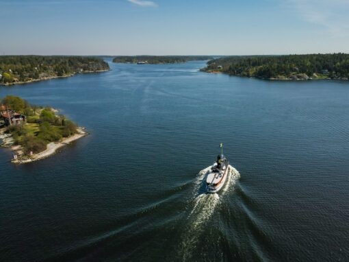 The steamship Blidösund goes into the water in the Stockholm archipelago, blue sky and sea